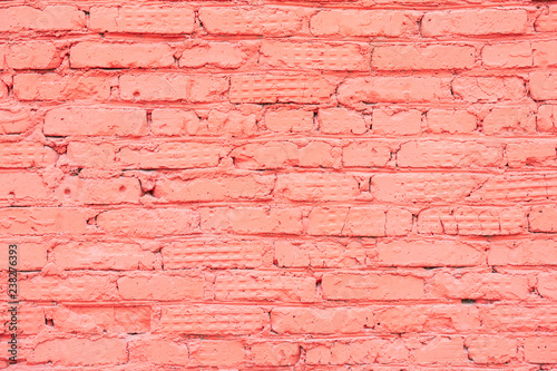 Painted vintage grunge brick wall texture  coral color  trendy urban background. Horizontal texture. For banner design