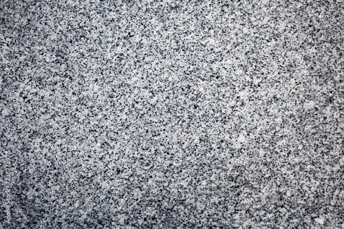 Black and white granite stone surface, perfect for use in background or texture.