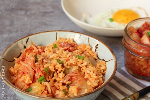 Homemade Kimchi fried rice topped with fried egg, selective focus