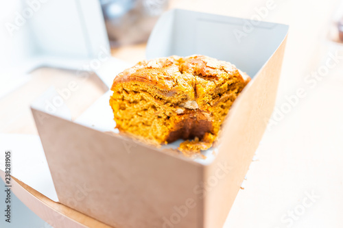 Cardboard box from store storebought bundt cake carrot or pumpkin halloween autumn christmas season dessert showing detail and texture photo