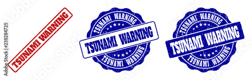 TSUNAMI WARNING scratched stamp seals in red and blue colors. Vector TSUNAMI WARNING marks with grainy effect. Graphic elements are rounded rectangles, rosettes, circles and text labels.