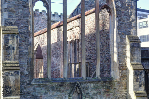 Gothic pointed arch windows on a stone wall without roof in the abandoned rumbled Temple Church in Bristol, in a sunny winter day, in United Kingdom
