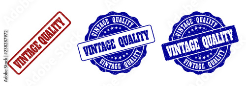 VINTAGE QUALITY scratched stamp seals in red and blue colors. Vector VINTAGE QUALITY watermarks with scratced style. Graphic elements are rounded rectangles, rosettes, circles and text tags.