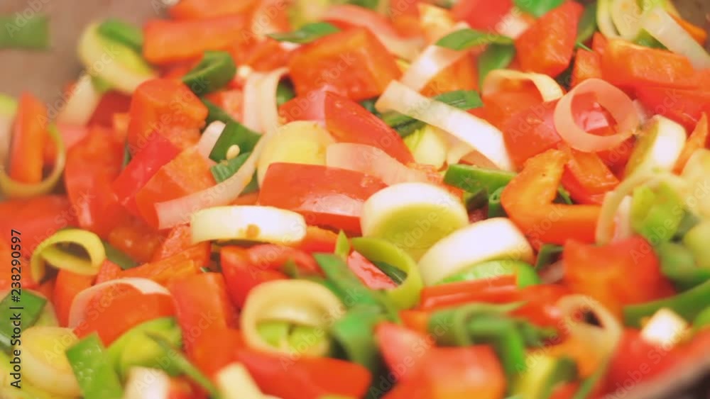 Stirring Spicy Mix Of Leek And Bell Pepper In The Process Of Cooking On Fire Stirring Spicy Mix Of Leek And Bell Pepper In The Process Of Cooking On Fire