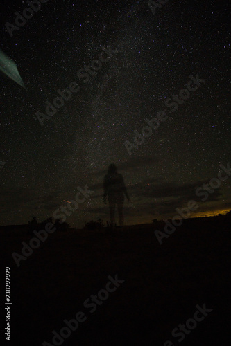 silhouette of person milky way