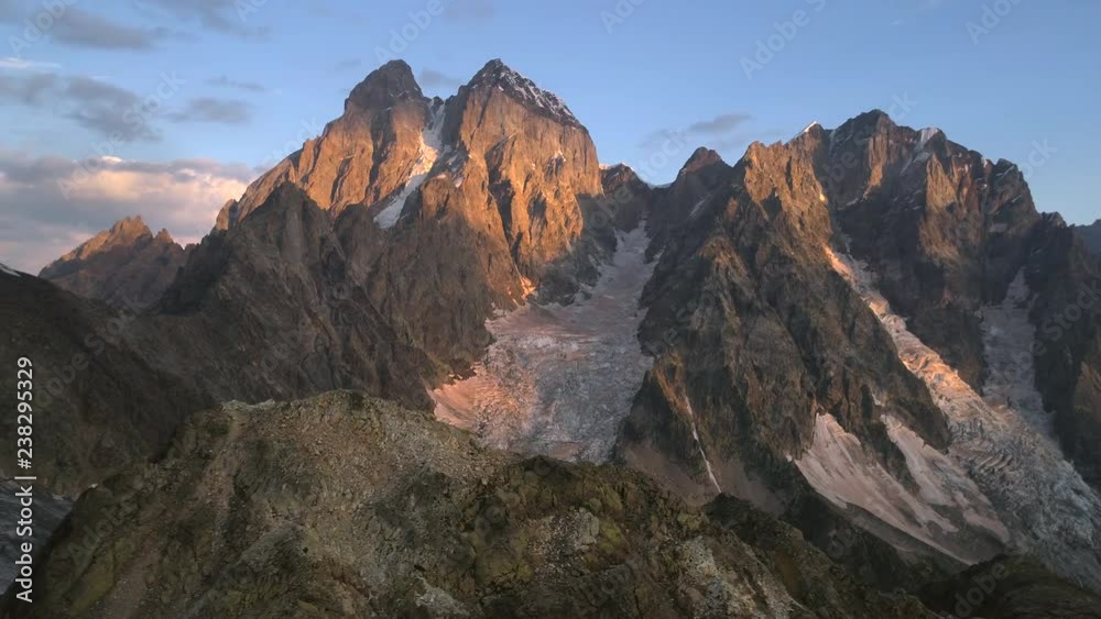 Aerial video of glacier in snowless mountains in the sunny evening, georgia Aerial video of glacier in snowless mountains in the sunny evening, georgia