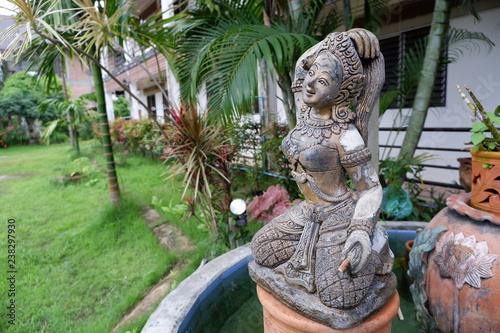 Statue of Mother Earth squeezes hair. Thai people call this Phra mae thorani beeb muay phom or Phra mae thorani twisting her hair. is an chthonic goddess from Buddhist mythology in Southeast Asia. photo