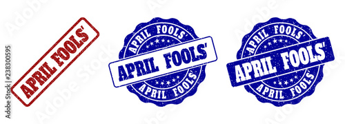 APRIL FOOLS' grunge stamp seals in red and blue colors. Vector APRIL FOOLS' labels with grunge surface. Graphic elements are rounded rectangles, rosettes, circles and text labels.