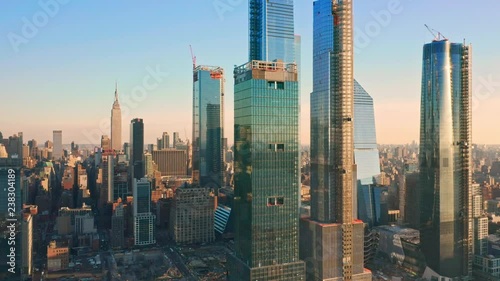 Aerial drone footage of New York skyline panning along Hudson Yards midtown Manhattan skyscrapers (some still being under construction) photo