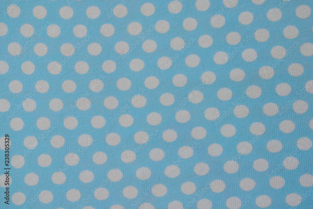White dots pattern on blue background. 