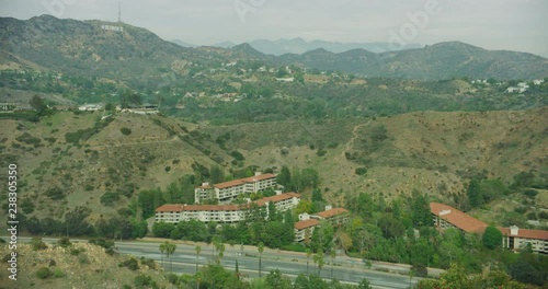 Timelapse of traffic on Hihgway 101 and the Hollywood sign. Los Angeles, California