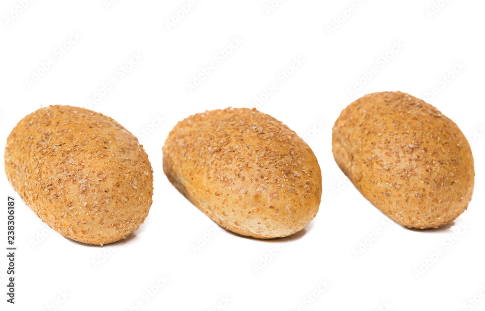 three dietary buns on a white background. bun of wholegrain three dietary buns on a white background. bun of wholegrain