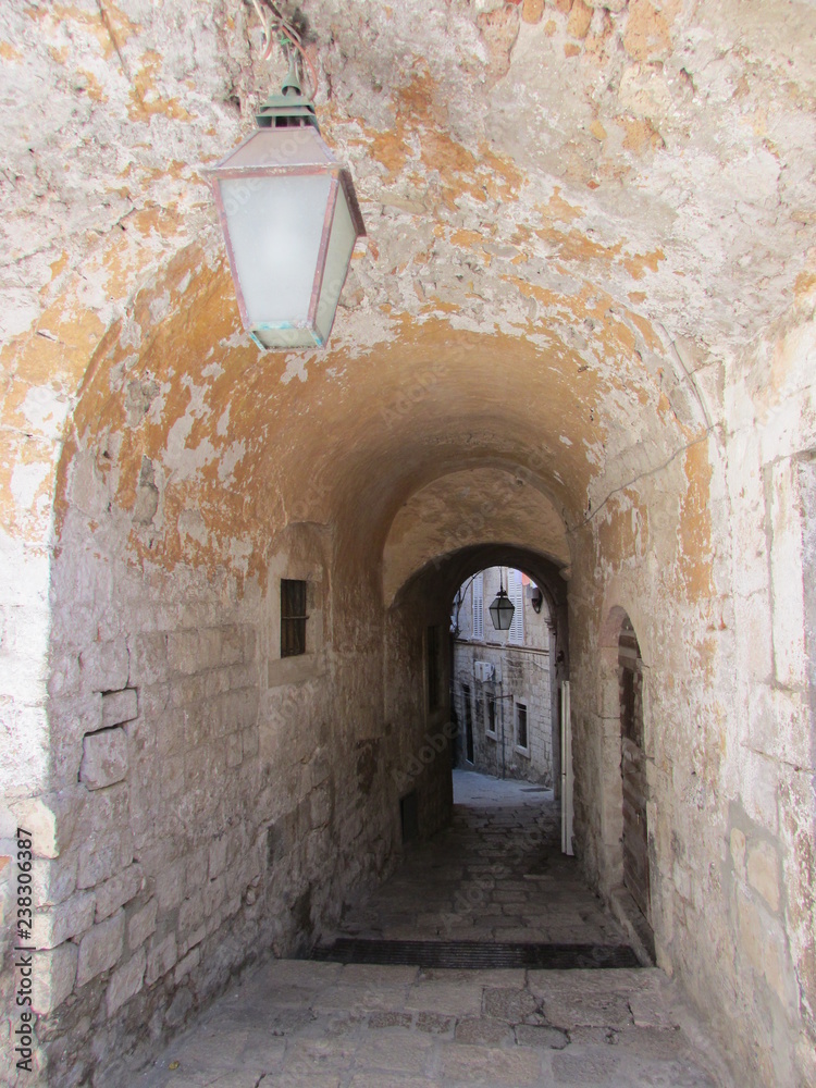 Arch on narrow street in Dubrovnik old town, Croatia