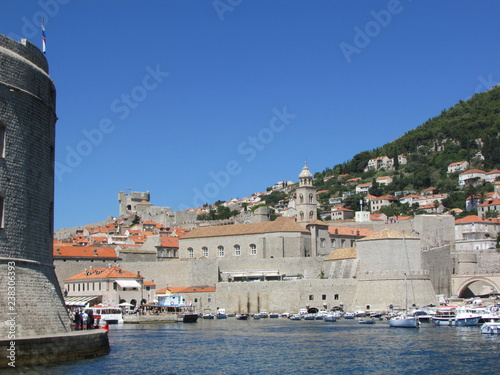 Dubrovnik old port in summer and fort st. Ivan, Croatia