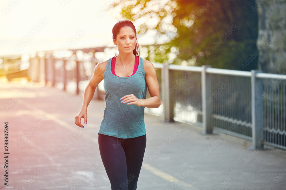 Woman Running at sunrise Woman Running at sunrise