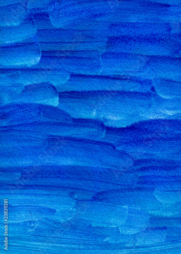 Blue monochrome brush strokes watercolor texture background. Manual work on paper with paints. Blurred, vertical, abstract.