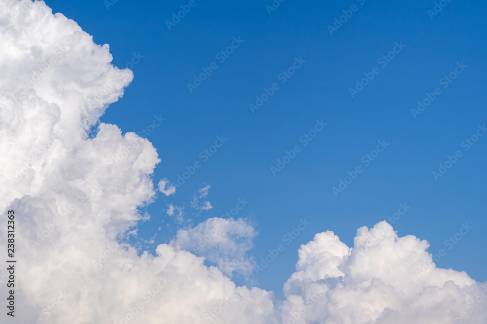 white dramatic cloud on bright blue sky background with copy space white dramatic cloud on bright blue sky background with copy space