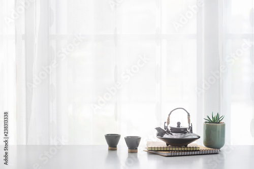 Japanese ceramic tea pot and tea cup  on table