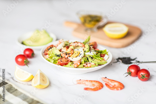 Fresh salad lying in white plate