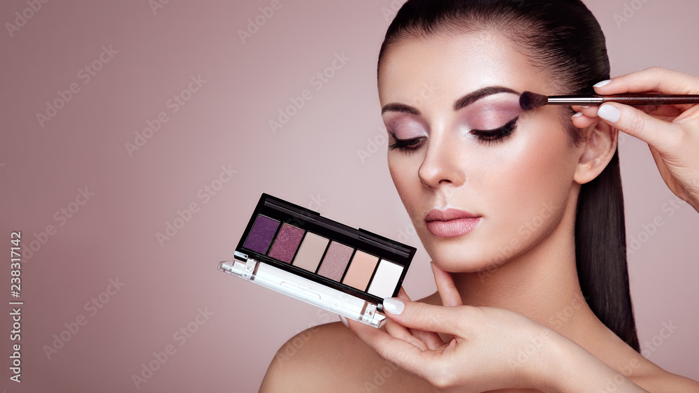 Makeup Artist applies Eye Shadow. Beautiful Woman Face. Perfect Makeup. Make -up detail. Beauty Girl with Perfect Skin. Nails and Manicure. Eye Shadow  Palette Photos | Adobe Stock