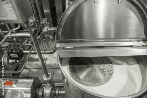 storage and pasteurization tank at the milk factory. equipment at the dairy plant photo