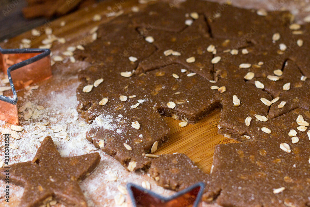 Making Star Oat Christmas Cookies in the kitchen before christmas for Santa Making Star Oat Christmas Cookies in the kitchen before christmas for Santa