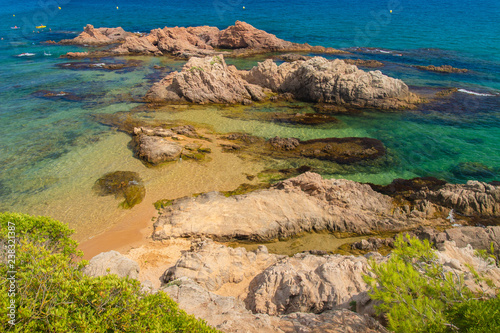 Cliff on sea beach in mediterranean on sunny day, Spain