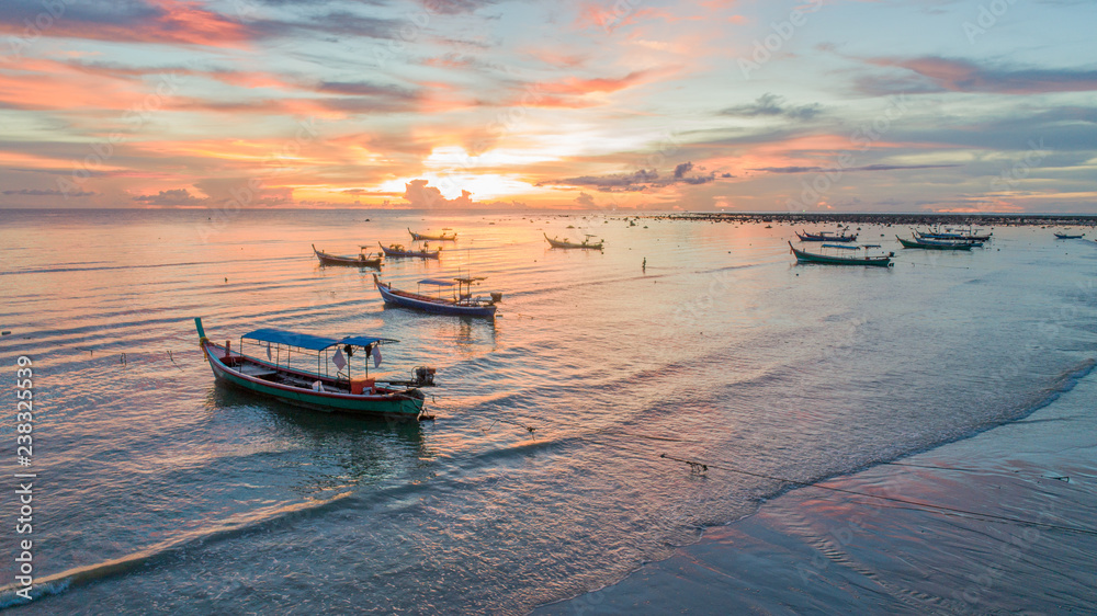 Aerial view beach sunset with fisherman boat at Phuket Thailand Aerial view beach sunset with fisherman boat at Phuket Thailand
