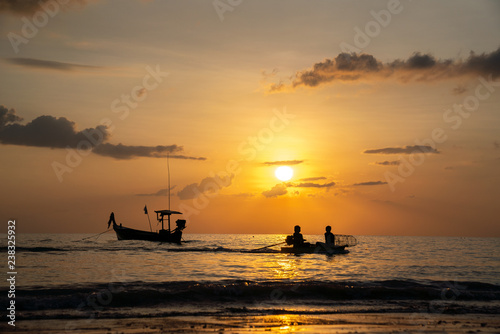 Beach sunset and fisherman boat for commercial background © bannafarsai