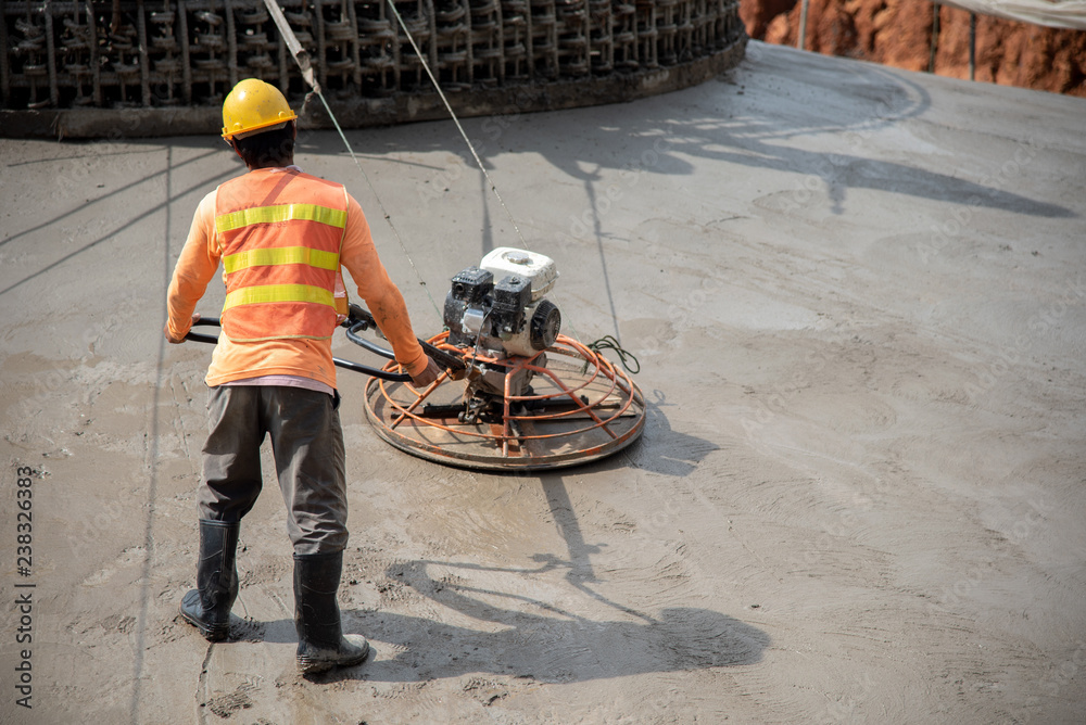 Construction worker wear standard safety uniform pouring and leveling ...