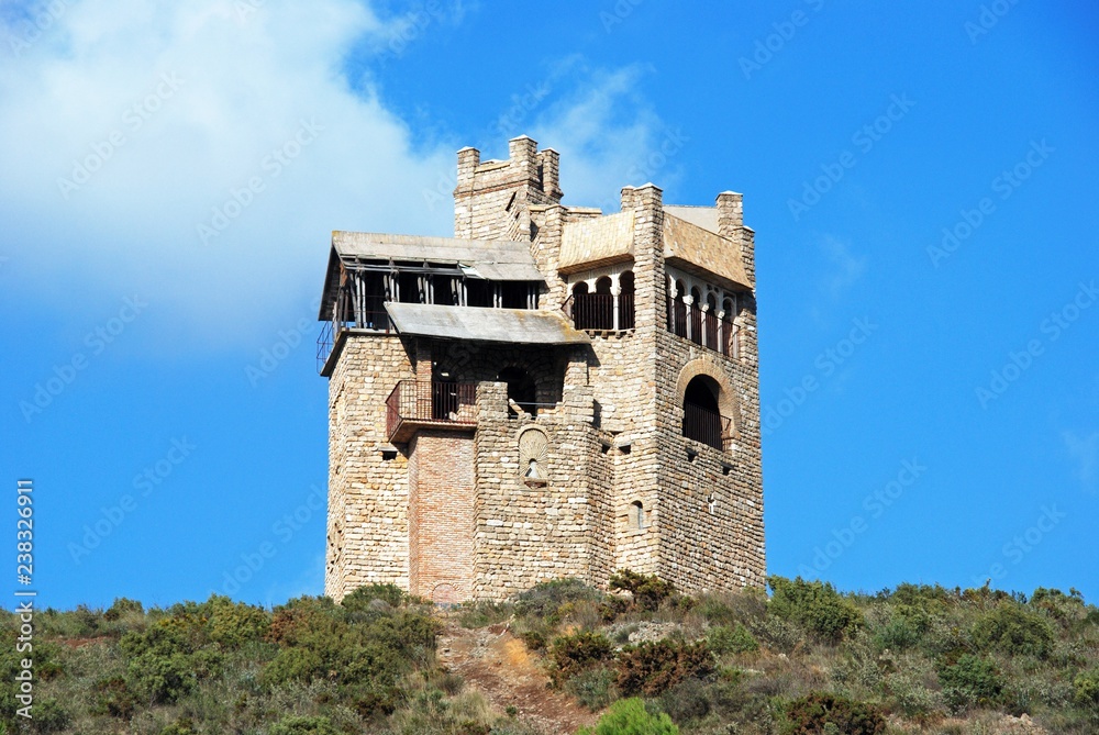 Folly in the countryside originally built as a water tower near Alhaurin El Grande, Spain.