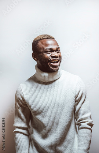 African young man wearing casual outfit looking at camera