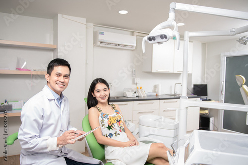 Wallpaper Mural Beautiful woman talk to dentist in dental clinic Torontodigital.ca