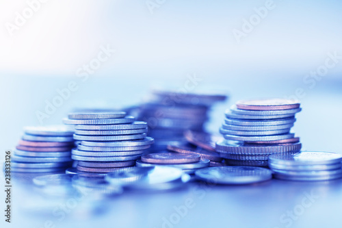 Row of coins on wood background for finance and Saving concept,Investment, Economy, Soft focus and dark style.