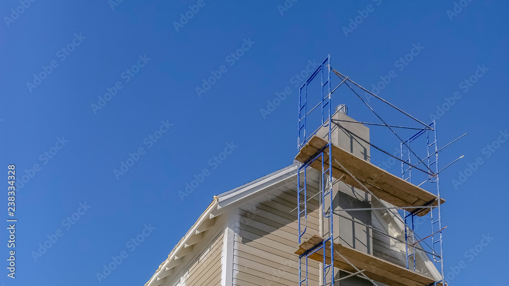 Scaffolding used in construction against blue sky Scaffolding used in construction against blue sky