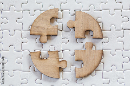 4 Four brown pieces of puzzle on a white jigsaw background, last piece of jigsaw puzzle to complete the mission, Business solutions, success and strategy concept