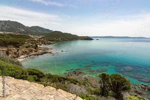 Fototapeta Naklejka Na Ścianę i Meble -  Pan di Zucchero Island from Porto Flavia Masua, Sulcis Sardinia Italy - Beach in Maditerranean Sea