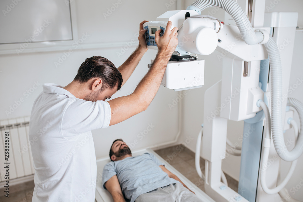 Medical Technician Operating an X-ray Machine Medical Technician Operating an X-ray Machine