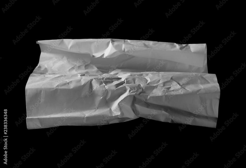 Crumpled paper isolated on black background 