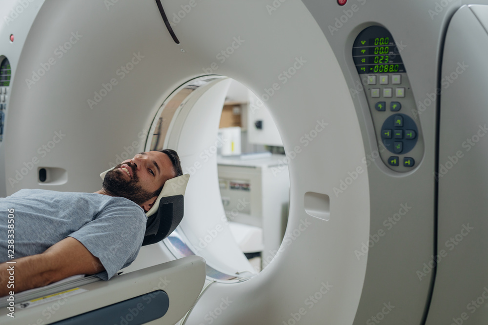 Patient Lying on the CT Scanner Bed Patient Lying on the CT Scanner Bed