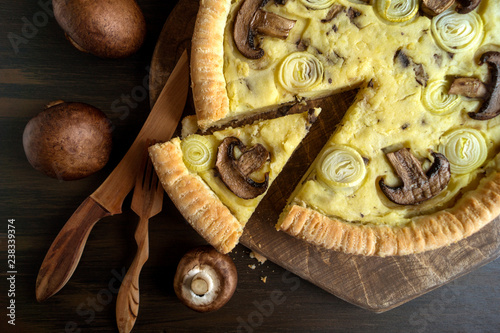 Homemade rustic potato pie with mushrooms and onions.