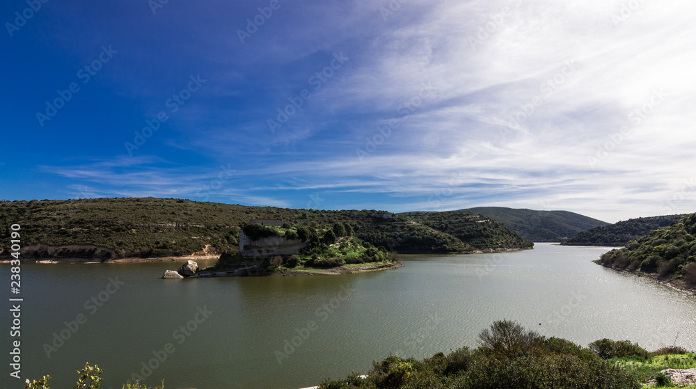 San Sebastian touristic island and church in Lake Barrocus in Isili  town in the historical region of Sarcidano, province of South Sardinia. Italy