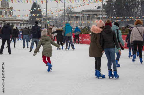 Kyiv Ukraine - 01.01.2018: happy people skating at the rink on the winter holidays