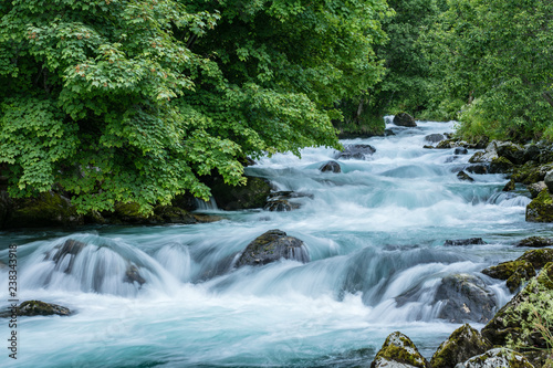 Fototapeta Naklejka Na Ścianę i Meble -  Turquoise flowing water in a river in Norway