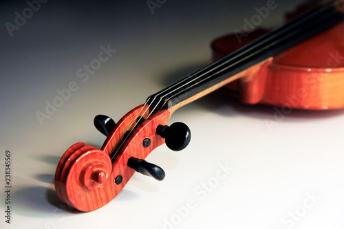 Old violin on the dim background
