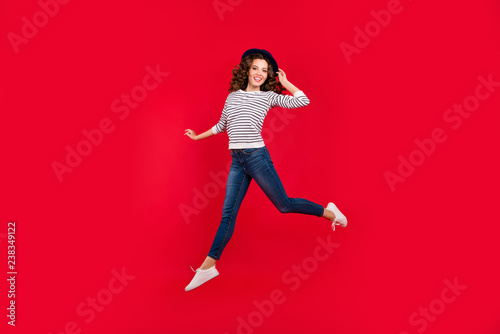 Full length size body photo of jumping high pretty charming she her girl raised arm with nice hat wearing white casual sweater on red vivid bright background