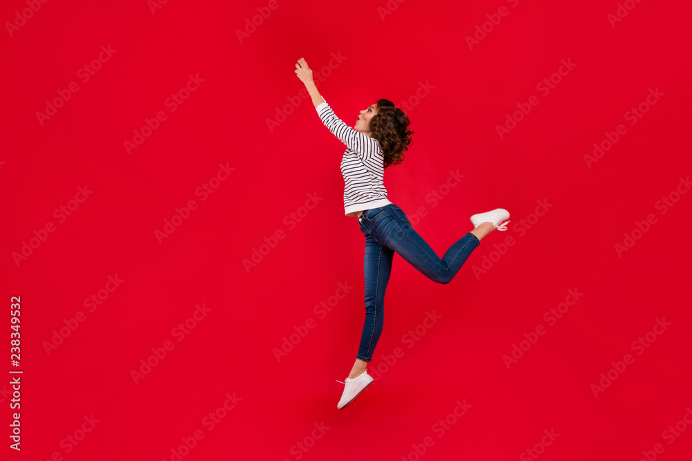 Full length size body photo of fly high in delight with invisible umbrella holding it by hands glad attractive she her girl wearing white casual sweater on red vivid bright background Full length size body photo of fly high in delight with invisible umbrella holding it by hands glad attractive she her girl wearing white casual sweater on red vivid bright background