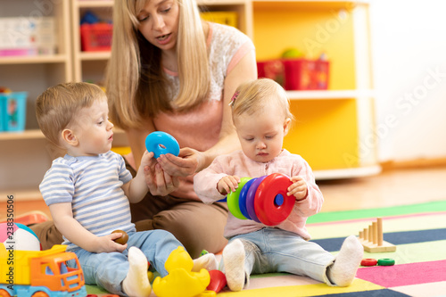 babysitter and children pla...
