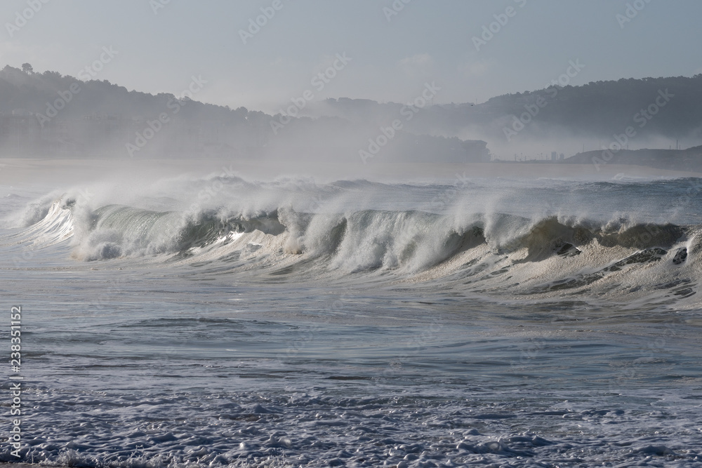 Atlantic wave on Nazare city beach, Portugal.