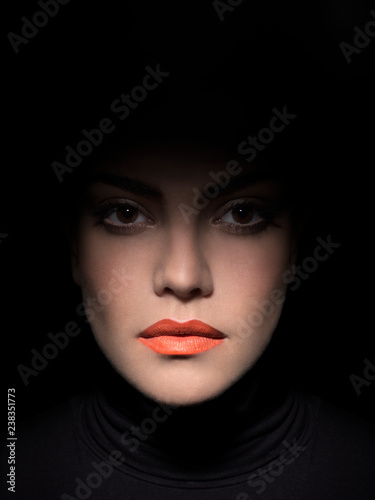 woman with brown eyes and orange lipstick